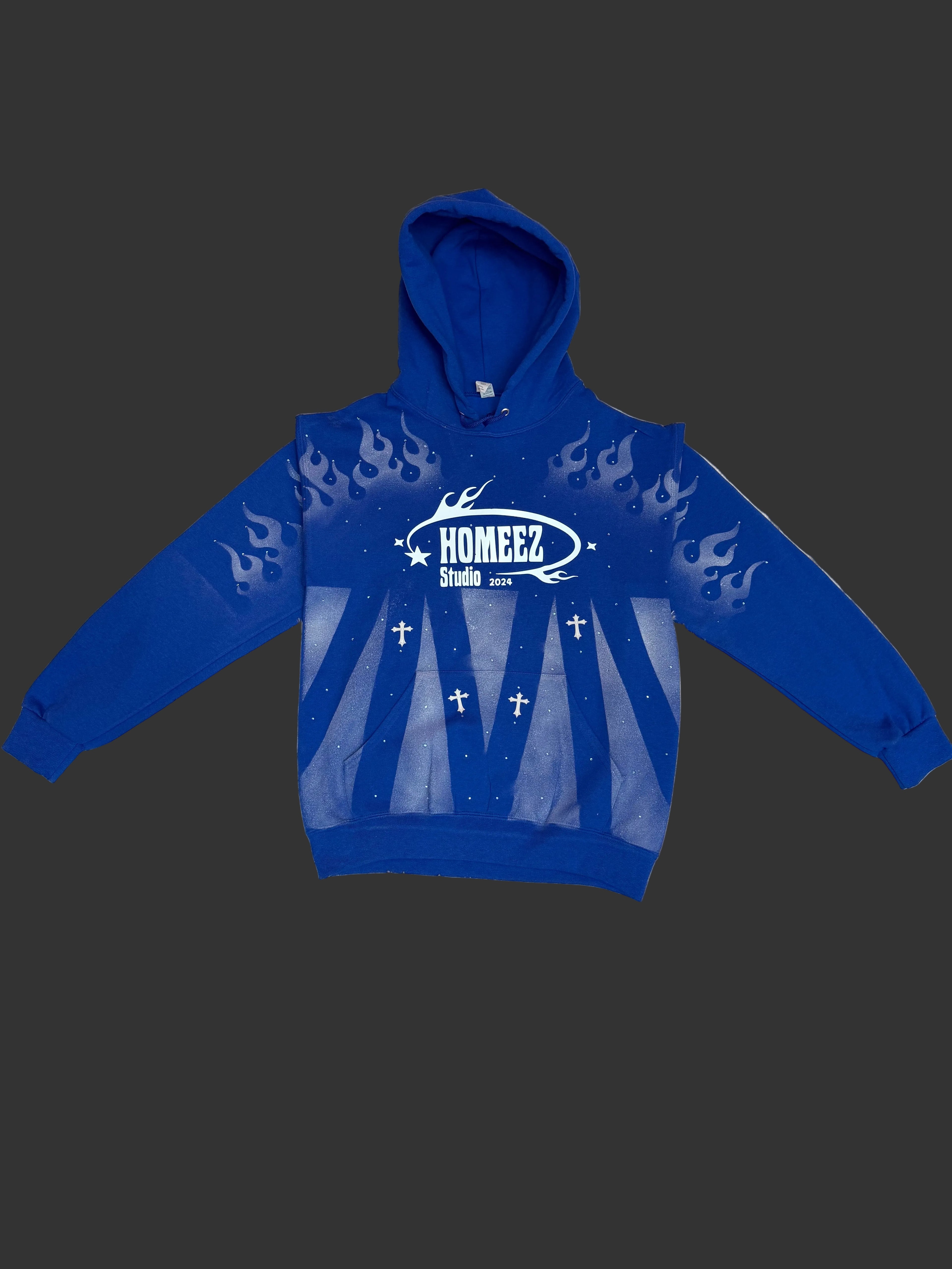 Blue hoodie with a logo on a textured surface